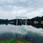 The torii at Camp Tengusanji, our hosts for the Pennsic Knowne World Courtesans Social on August 10, 2017 A torii with four koinobori standing in a lake