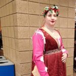 Courtesan Honora de Cunningham at Twelfth Night in Northshield on January 14, 2023. A woman in Italian Renaissance clothing standing indoors posing