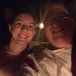 Courtesan Ginevra Fiammetta di Silvestri with patron and Tullian Vytautas Vilkas at Clan Blue Feather's Pizza: Food of the Gods party at Pennsic on August 6, 2015 Closeup of two people in ancient Roman clothing smiling at the camera outdoors at night
